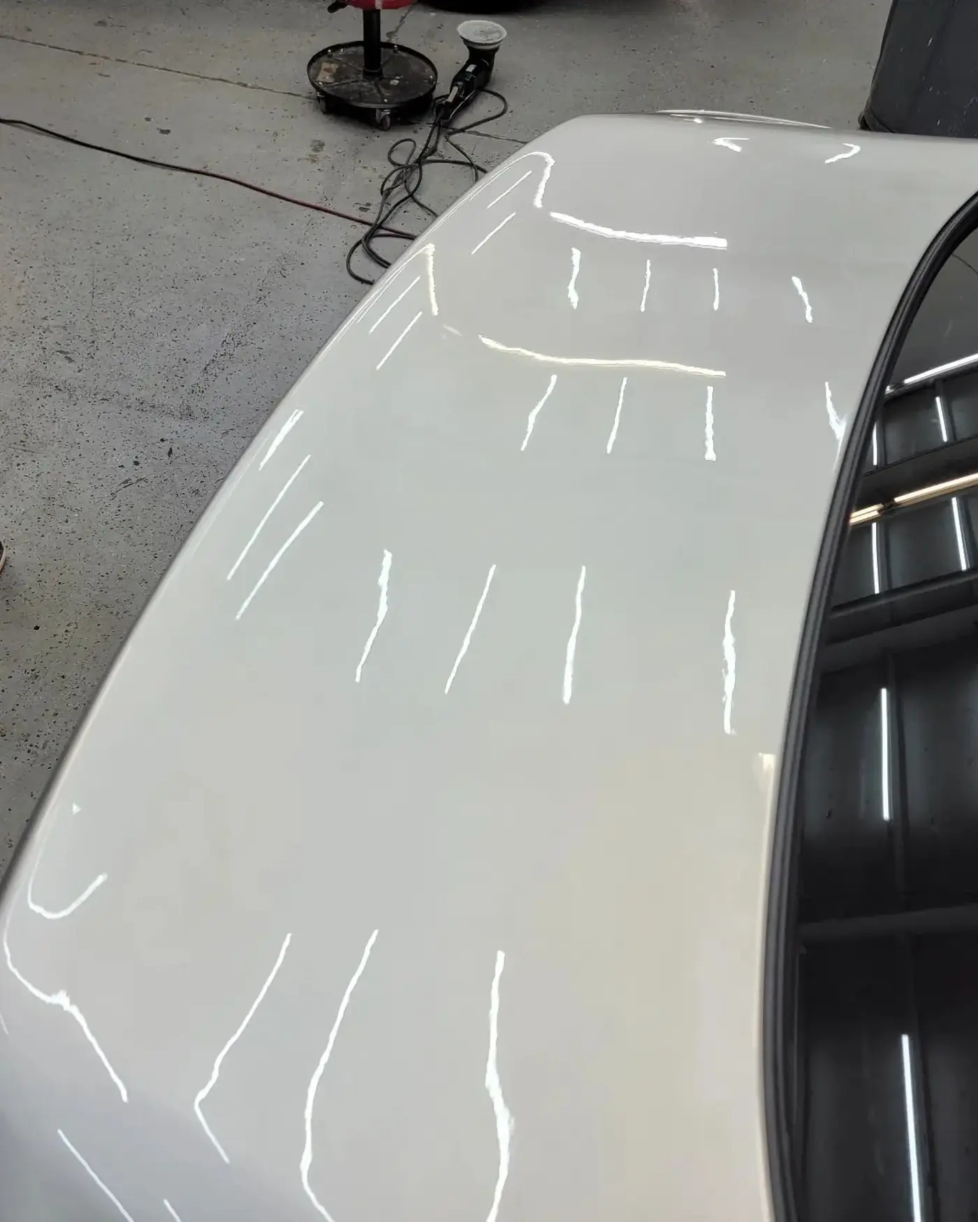 After: Reflection lines across a white panel
