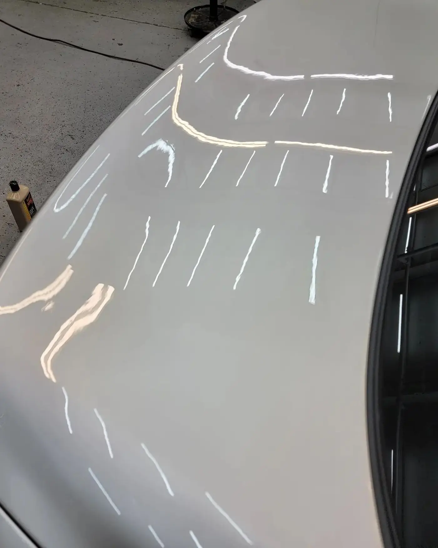 Before: Reflection lines across a white panel