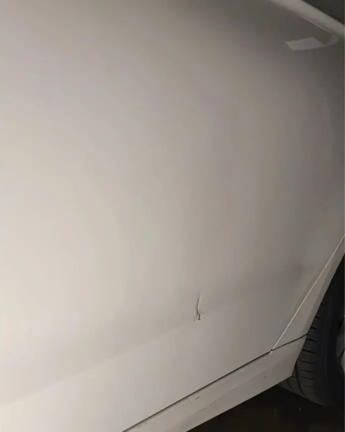 After: Body-line crease on a white door