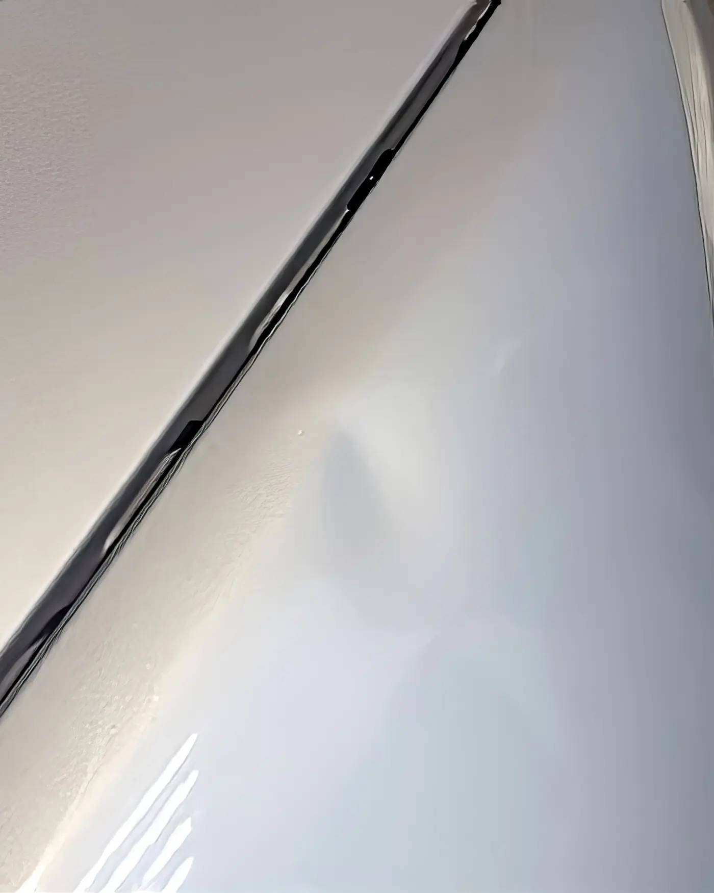 Before: Crease along a silver panel